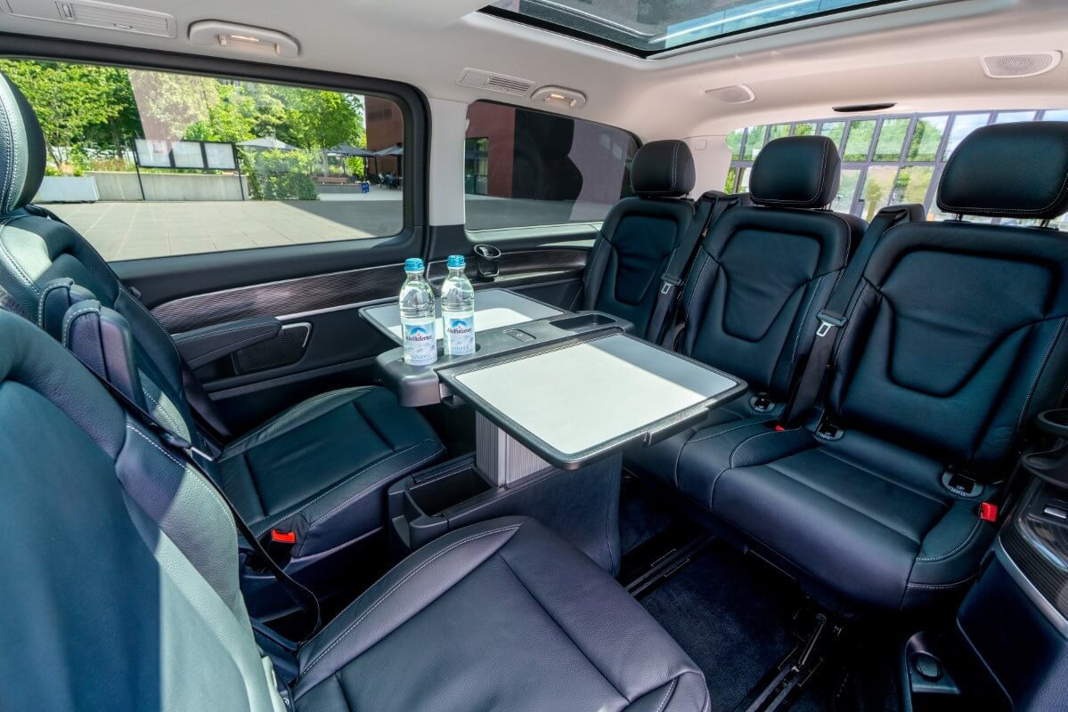 Minivan Mercedes V300d 4matic interior back with working tables.